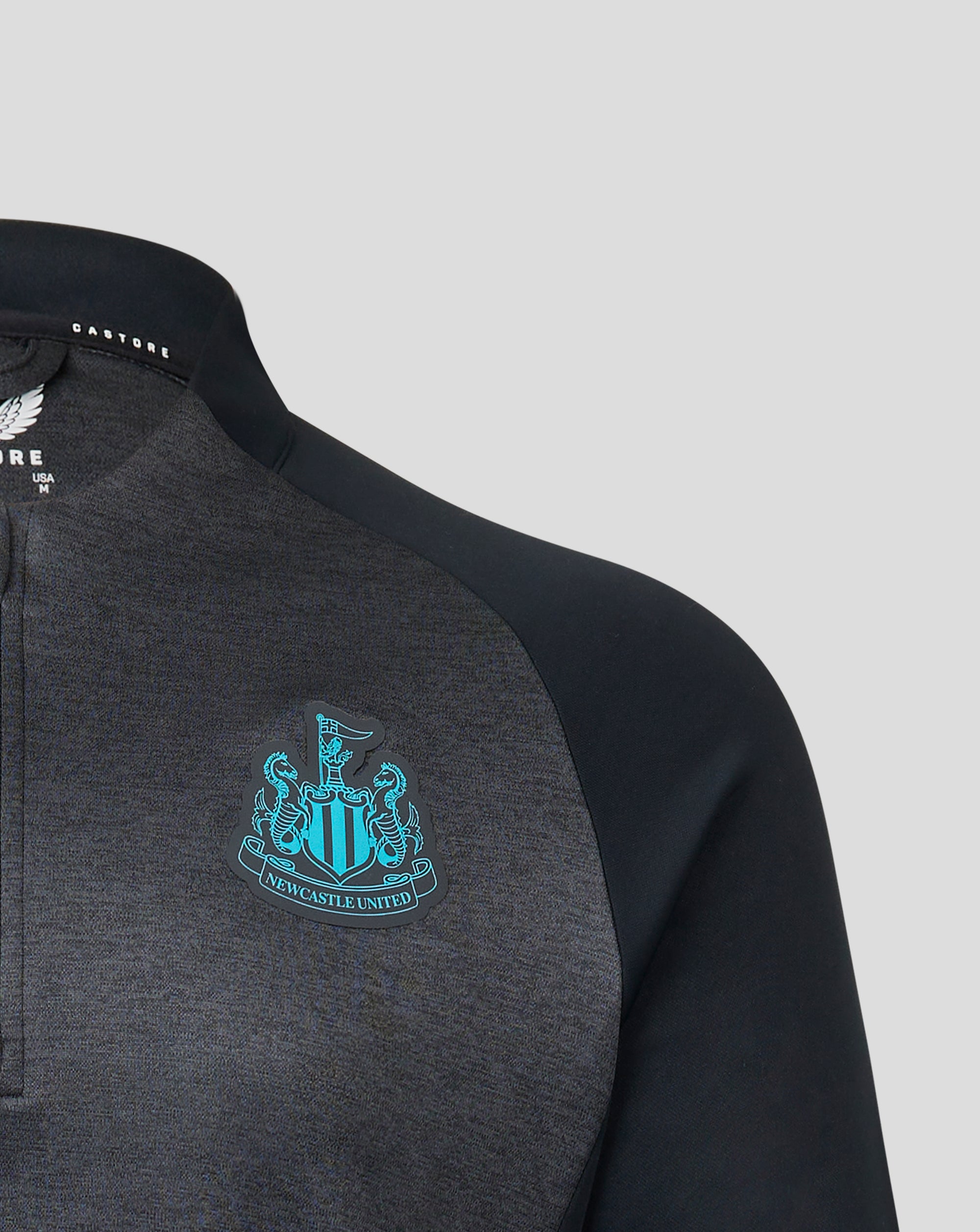 Black and grey Newcastle United 1/4 zip top